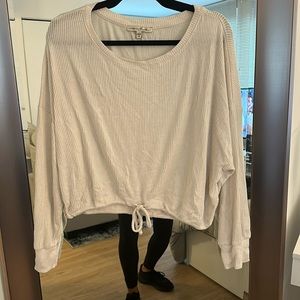 Cream longer sleeve ribbed long sleeves with a tie bottom